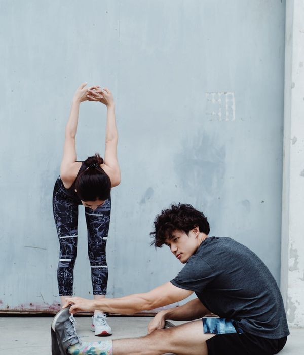 Man stretching outdoors, looking refreshed and flexible.